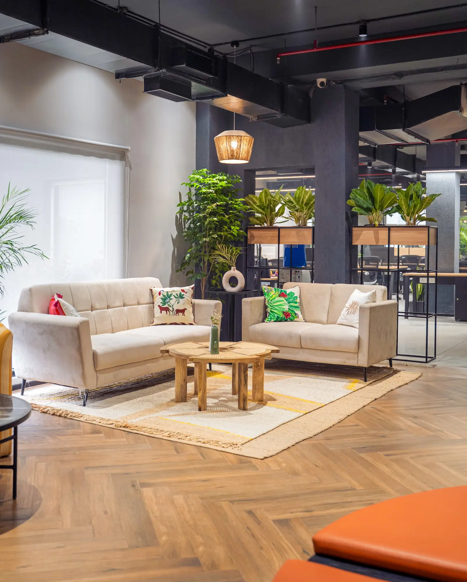 A warm office lounge with collaborative seating